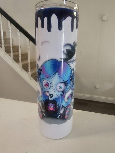 Tall tumbler featuring a colorful, cartoonish character with large eyes and dripping paint design.
