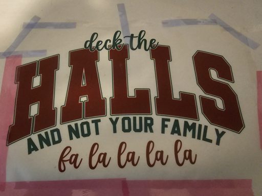 Text displaying "Deck the Halls and Not Your Family" with festive colors and style.